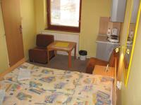 A bed or beds in a room at Chalupa LUKA Terchová