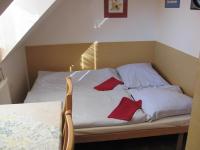A bed or beds in a room at Chalupa LUKA Terchová