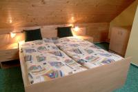A bed or beds in a room at Chalupa LUKA Terchová