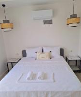 A bed or beds in a room at Ozilvillas