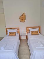 A bed or beds in a room at Ozilvillas