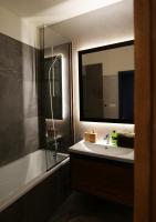 A bathroom at Apartmán - modern home