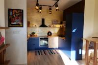 A kitchen or kitchenette at Apartmán - modern home