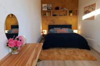 A bed or beds in a room at Apartmán - modern home