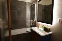 A bathroom at Apartmán - modern home