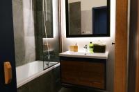 A bathroom at Apartmán - modern home
