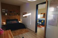 A bed or beds in a room at Apartmán - modern home