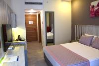 Postel nebo postele na pokoji v ubytování Bodrum Park Resort