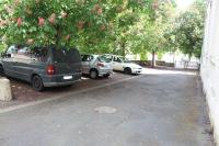 a group of cars parked in a parking lot at Appartement calme proche de la Loire in Saumur