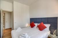 A bed or beds in a room at Magia at Colosseum