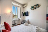 A bed or beds in a room at Magia at Colosseum