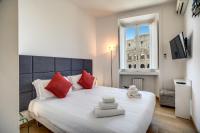 A bed or beds in a room at Magia at Colosseum