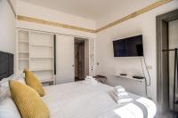 A bed or beds in a room at Magia at Colosseum