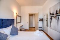A bed or beds in a room at Magia at Colosseum