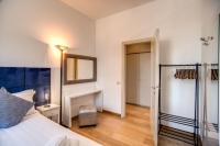 A bed or beds in a room at Magia at Colosseum