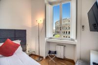A bed or beds in a room at Magia at Colosseum