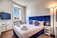 A bed or beds in a room at Magia at Colosseum