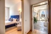 A bed or beds in a room at Magia at Colosseum