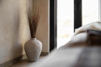 Postel nebo postele na pokoji v ubytování Opuntia Suites