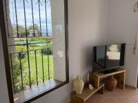 TV a/nebo společenská místnost v ubytování Villa Tropical Dream