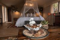Umkumbe Bush Lodge - Luxury Tented Campにあるベッド