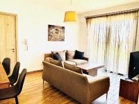 TV a/nebo společenská místnost v ubytování BALI SUITES 404