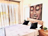Postel nebo postele na pokoji v ubytování BALI SUITES 404