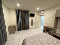 Łóżko lub łóżka w pokoju w obiekcie Akoya Rooms Capo Vaticano