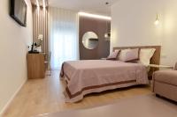 a bedroom with a bed and a table and a couch at Dimora Al Castello in Matera