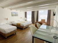 Een bed of bedden in een kamer bij Hotel Residence Le Coin