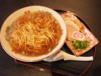a plate with a bowl of soup and a sandwich at Onsen Urashima in Onomichi