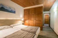 Postel nebo postele na pokoji v ubytování Hotel SNÖ Mont Romies