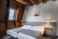 Postel nebo postele na pokoji v ubytování Hotel SNÖ Mont Romies