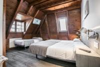 Postel nebo postele na pokoji v ubytování Hotel SNÖ Mont Romies