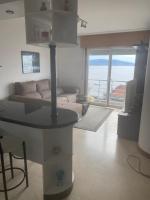 Posedenie v ubytovaní precioso apartamento con vistas al mar
