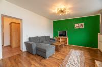 Televízia a/alebo spoločenská miestnosť v ubytovaní Anblick Appartement with lake view