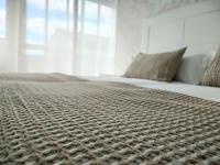 A bed or beds in a room at Second Home Arzúa apartamentos