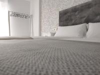 A bed or beds in a room at Second Home Arzúa apartamentos