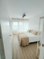 A bed or beds in a room at Second Home Arzúa apartamentos