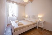 Posteľ alebo postele v izbe v ubytovaní Sea view New Apartment Ortigia