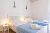 Posteľ alebo postele v izbe v ubytovaní Sea view New Apartment Ortigia
