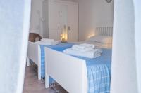 Posteľ alebo postele v izbe v ubytovaní Sea view New Apartment Ortigia