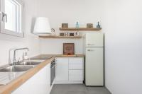 Kuchyňa alebo kuchynka v ubytovaní Elyos Apartments