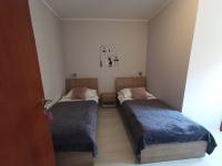 Posteľ alebo postele v izbe v ubytovaní Apartments & Rooms Krecak Sibenik