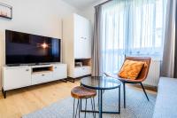 A television and/or entertainment centre at Apartment Harmony - Tatranska Lomnica, Javorinka