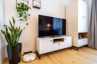 A television and/or entertainment centre at Apartment Harmony - Tatranska Lomnica, Javorinka