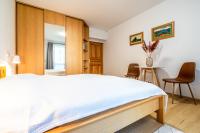 A bed or beds in a room at Apartment Harmony - Tatranska Lomnica, Javorinka