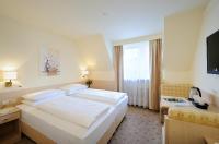 Postel nebo postele na pokoji v ubytování Hotel Scherer