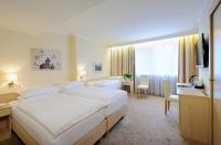 Postel nebo postele na pokoji v ubytování Hotel Scherer