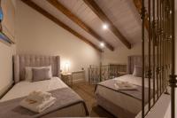 Posteľ alebo postele v izbe v ubytovaní Capolavoro Suites